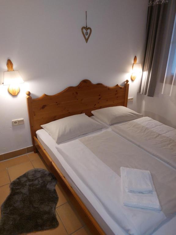 Postel nebo postele na pokoji v ubytování Apartment Gerlitzen Garden