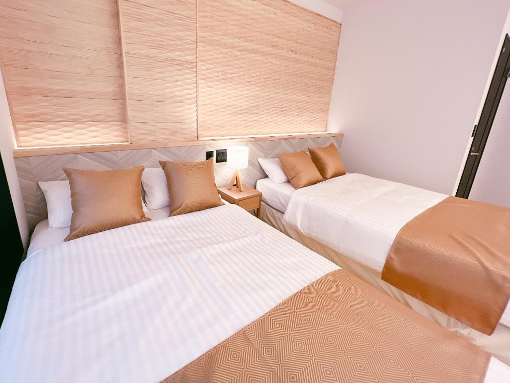 Postel nebo postele na pokoji v ubytování FELIZ ARIFUKU ONSEN