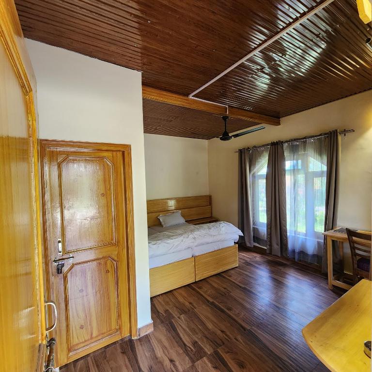 Postel nebo postele na pokoji v ubytování Namlang Resort