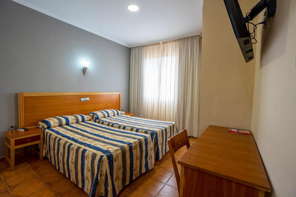 Postel nebo postele na pokoji v ubytování Hotel Los Barruecos by Croma