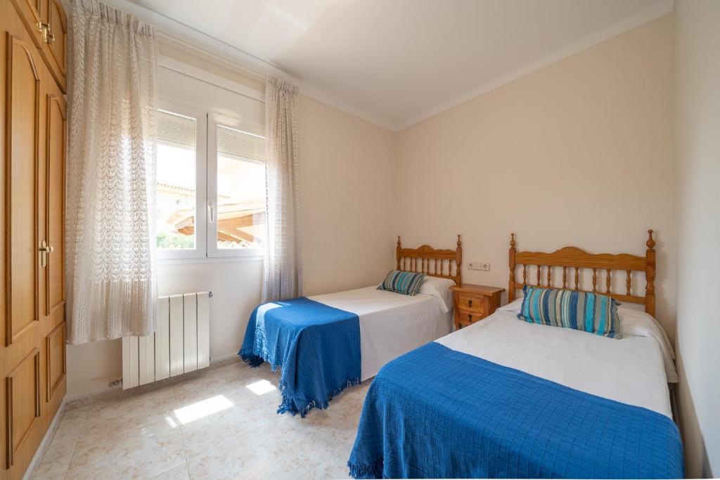 Postel nebo postele na pokoji v ubytování Villa Mercedes
