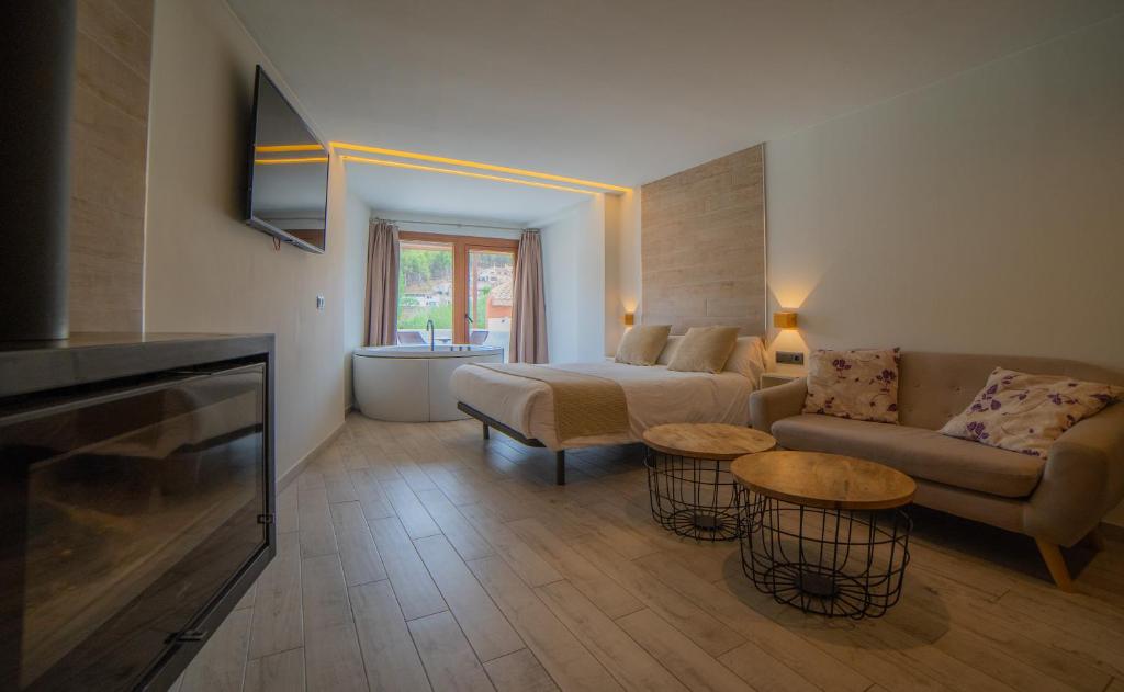 a living room with a couch and a table at Estudio Los Olivos in Alcalá del Júcar