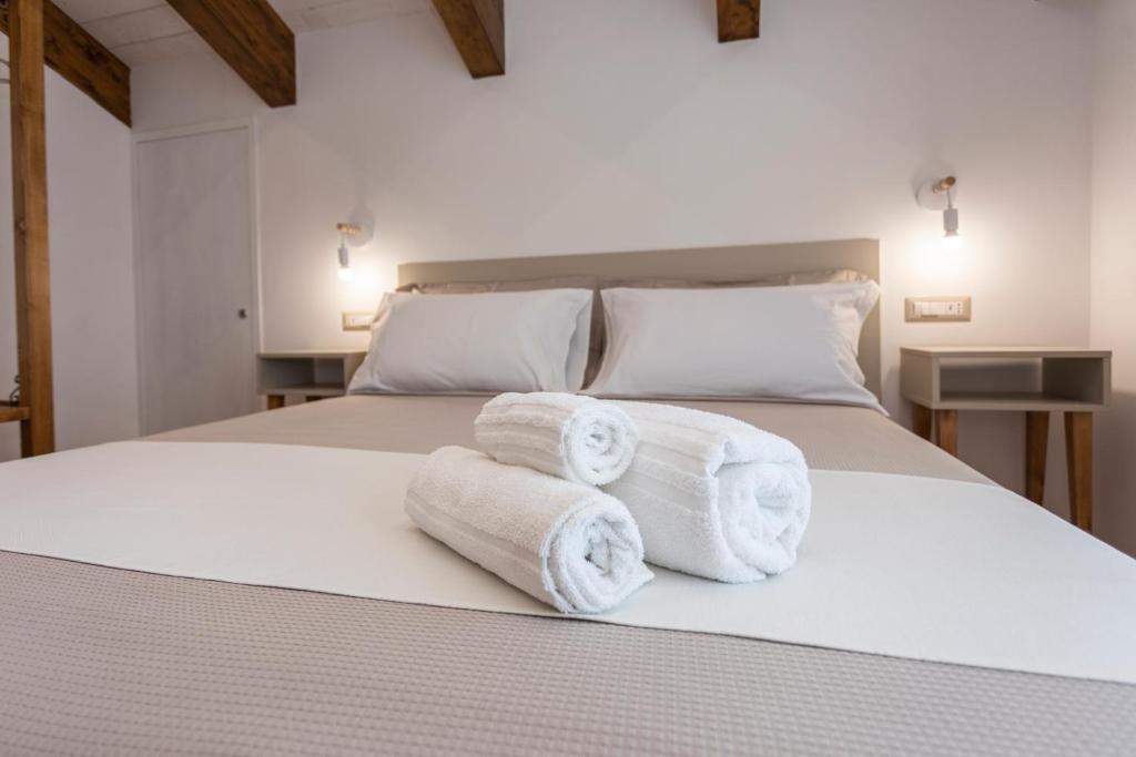 Postel nebo postele na pokoji v ubytování Agriturismo Punta San Lazzaro