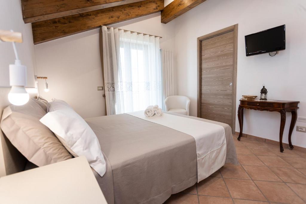 Postel nebo postele na pokoji v ubytování Agriturismo Punta San Lazzaro
