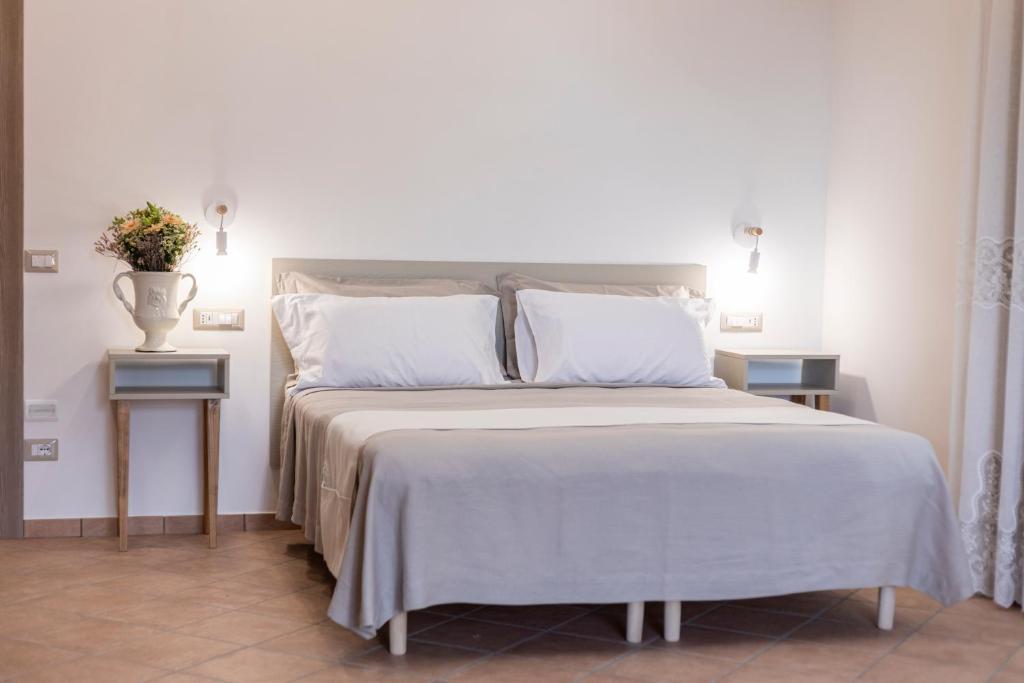 Postel nebo postele na pokoji v ubytování Agriturismo Punta San Lazzaro