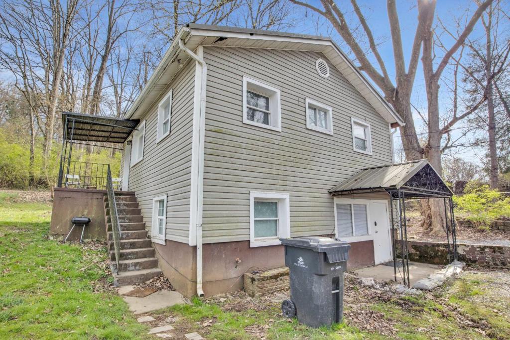 a house with a porch and a trash can in front of it at Small 2br East Knox apartment Pet friendly in Knoxville