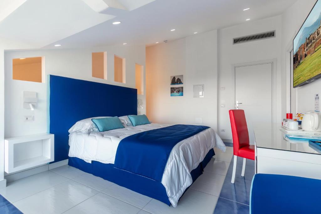 Postel nebo postele na pokoji v ubytování Hotel Metropole