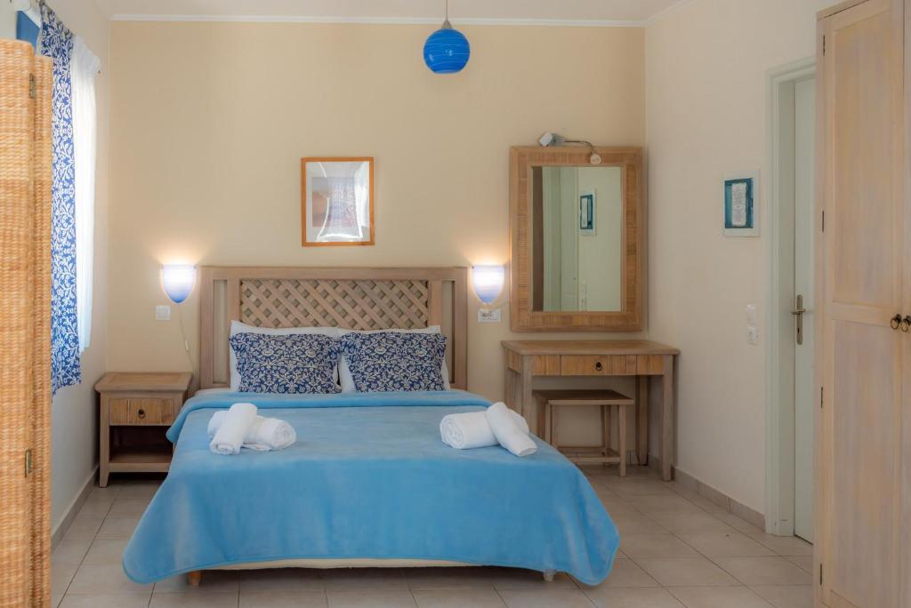 シロピカドにあるModi Resortのベッドルーム1室(ブルーベッド1台、タオル2枚付)