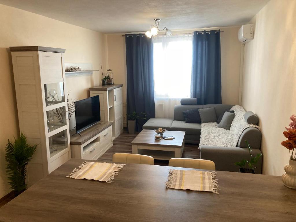 a living room with a couch and a table at 2 Rooms Apartment in Michalovce in Michalovce
