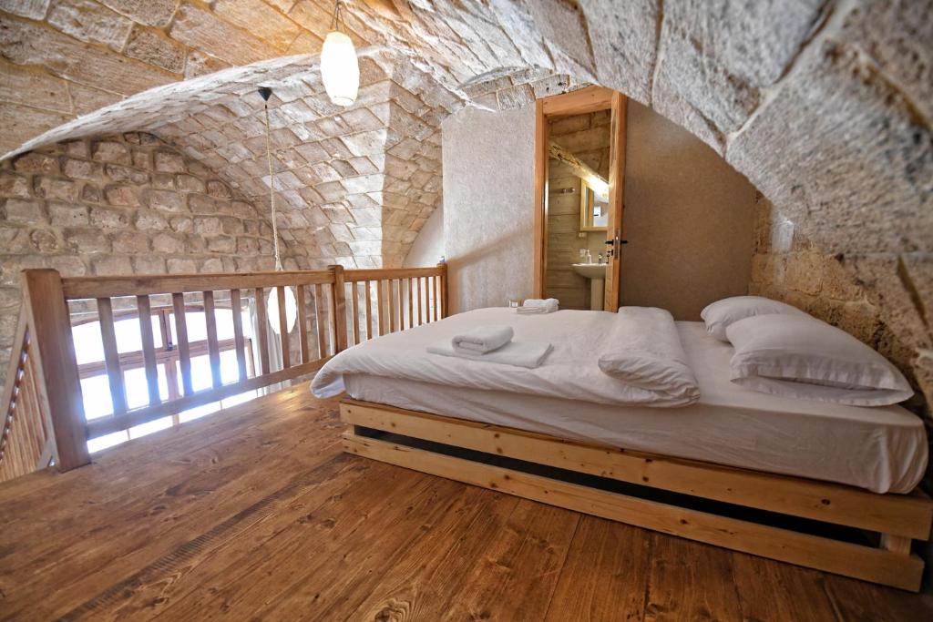 Postel nebo postele na pokoji v ubytování Old Town Guesthouses