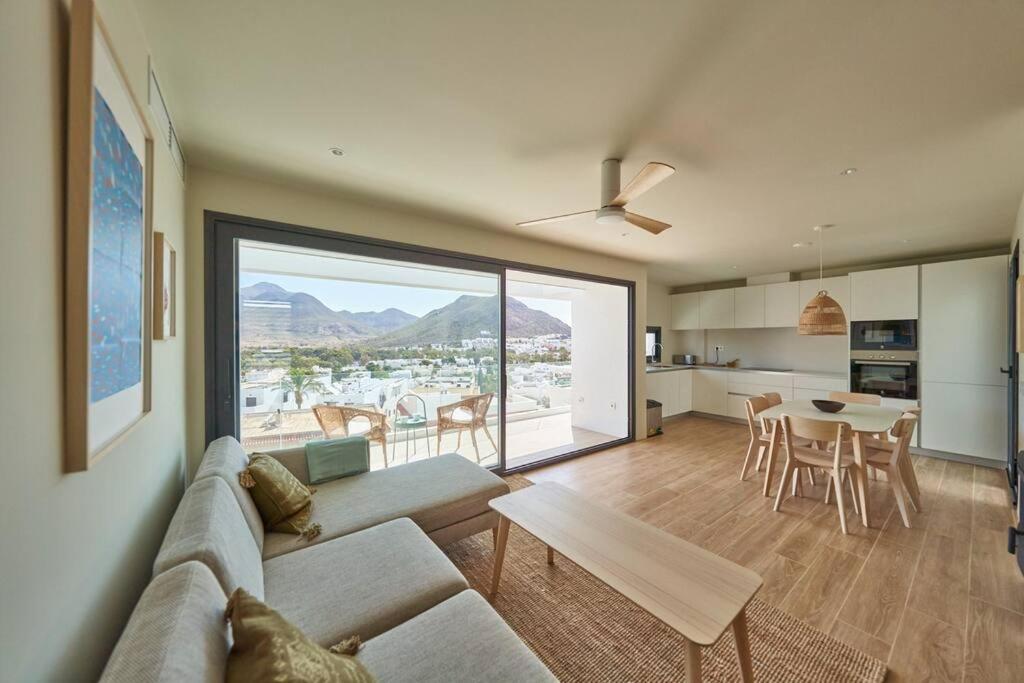 a living room with a couch and a table at Casa del Mar in San José