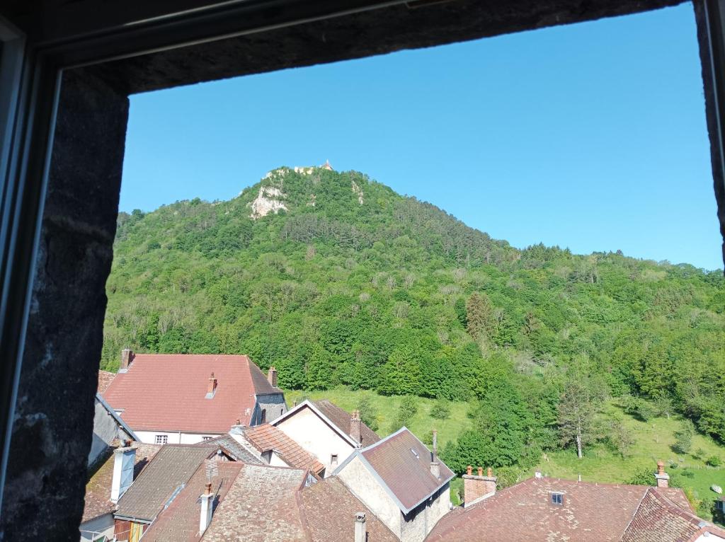 a view from a window of a mountain at O&#39;Couvent - Appartement 62 m2 - 2 chambres - A513 in Salins-les-Bains