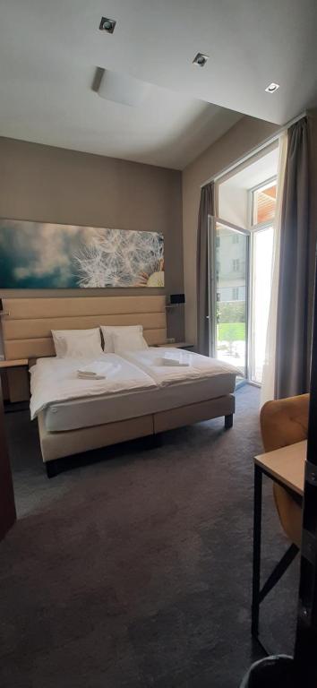 Postel nebo postele na pokoji v ubytování Inter Hotel