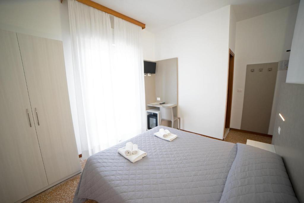 Postel nebo postele na pokoji v ubytování Hotel Ischia