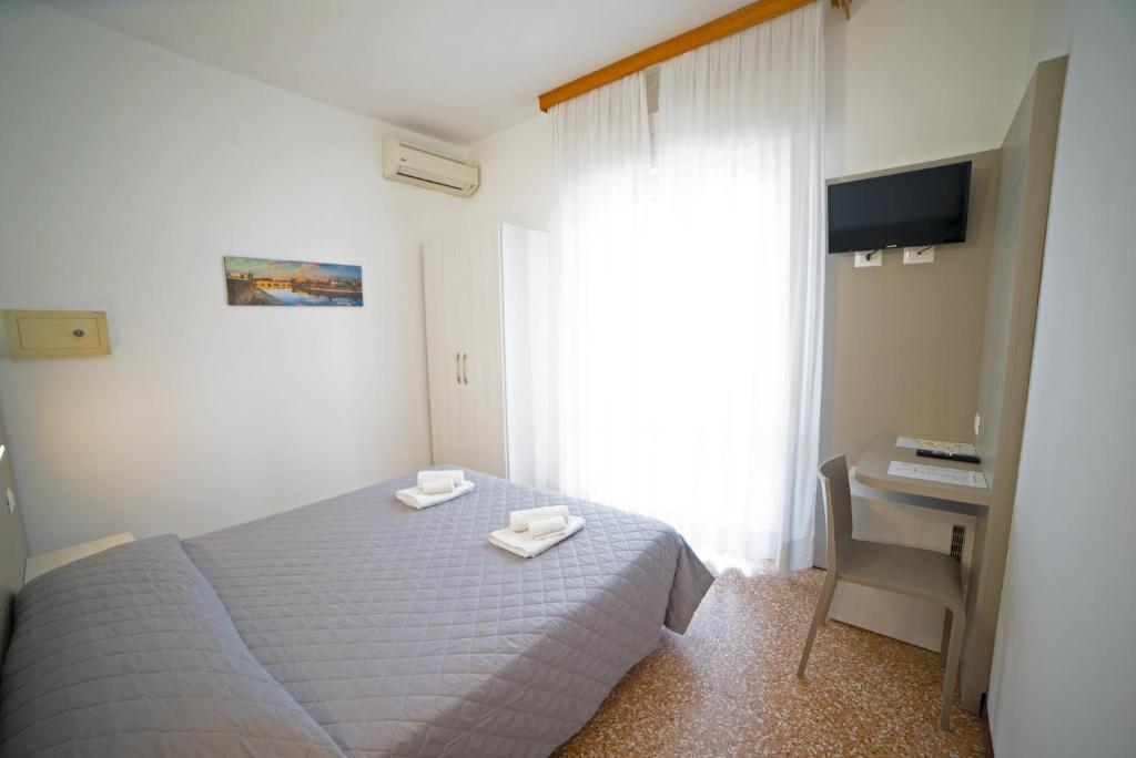 Postel nebo postele na pokoji v ubytování Hotel Ischia