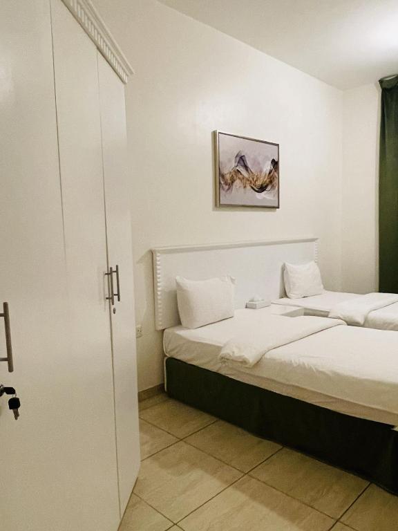 Postel nebo postele na pokoji v ubytování Husin Al Khaleej Hotel Apartment