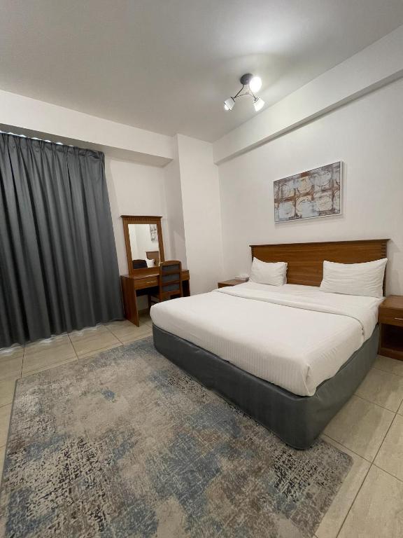 Postel nebo postele na pokoji v ubytování Husin Al Khaleej Hotel Apartment