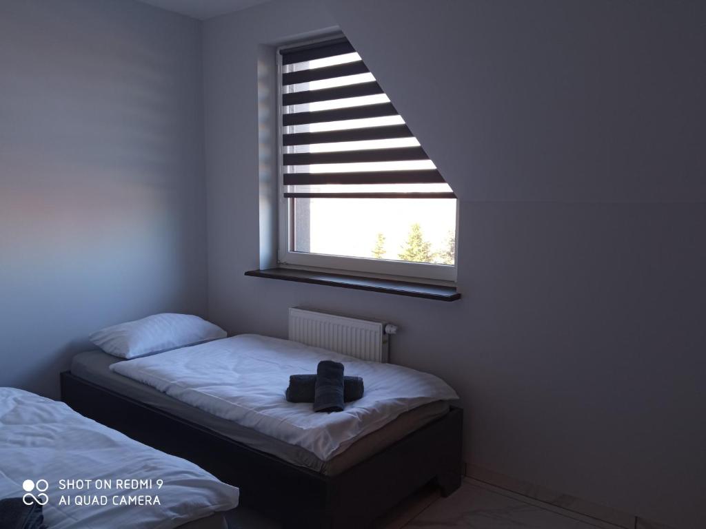 Posteľ alebo postele v izbe v ubytovaní Noclegi Abramowicka