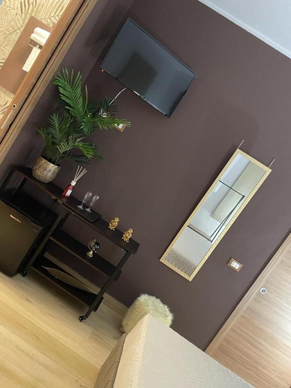 TV a/nebo společenská místnost v ubytování RESIDENCE GORDON