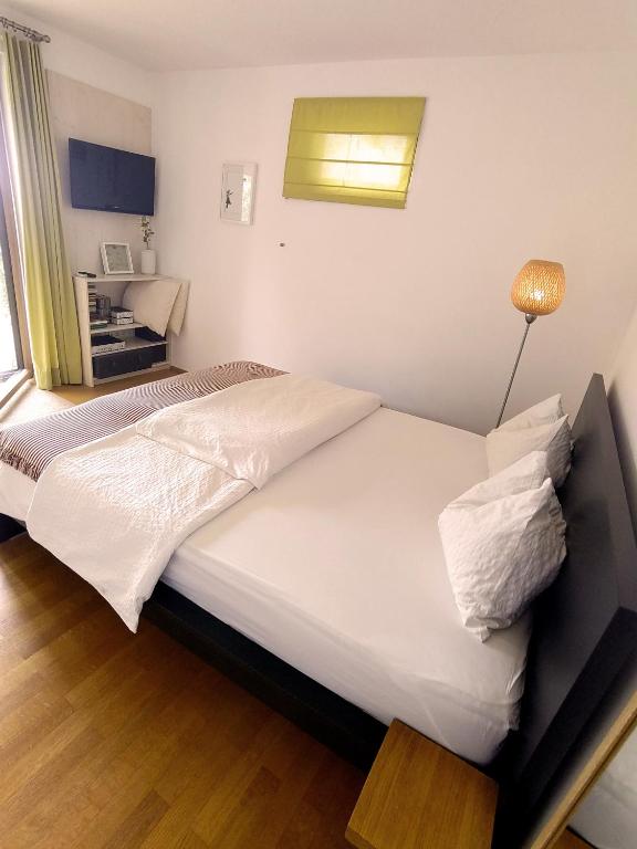 Postel nebo postele na pokoji v ubytování B&B Rosenrot