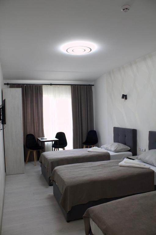 Postel nebo postele na pokoji v ubytování Forsage Hotel