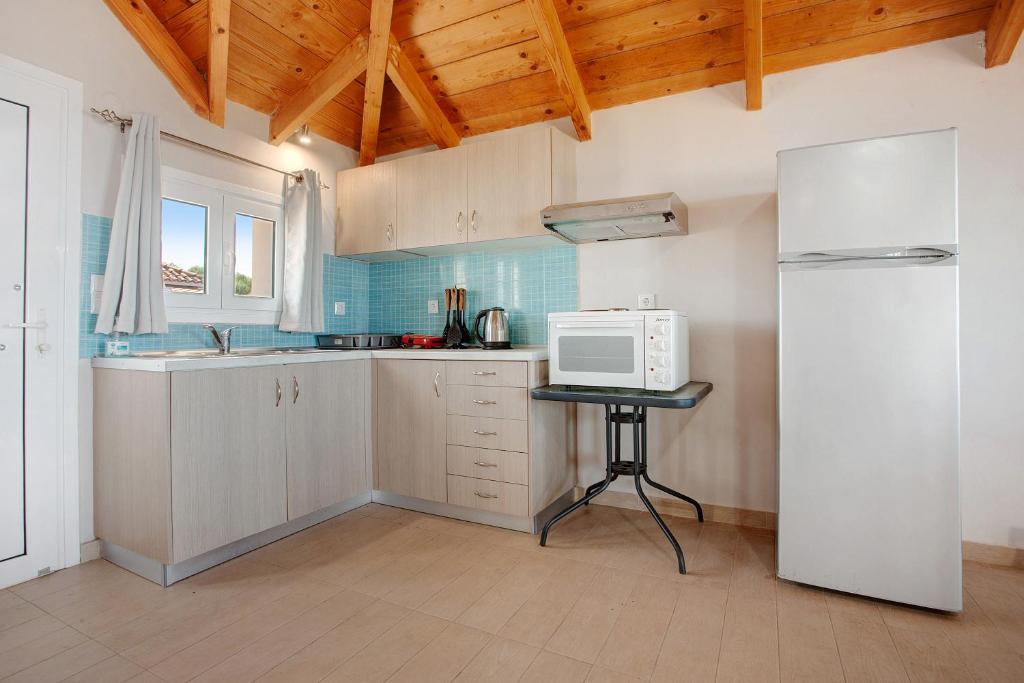 A kitchen or kitchenette at Yiannis Suite with Sea View 10