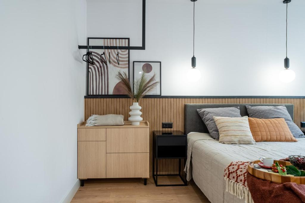 Posteľ alebo postele v izbe v ubytovaní Apartamenty Stara Warszawska 43