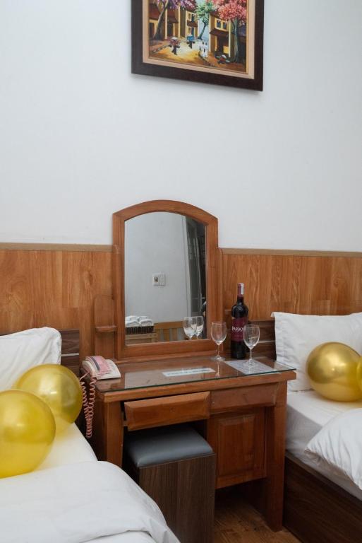 Postel nebo postele na pokoji v ubytování HOTTEL PHƯƠNG ĐÔNG