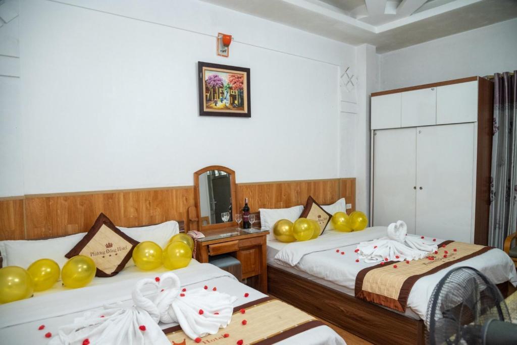 Postel nebo postele na pokoji v ubytování HOTTEL PHƯƠNG ĐÔNG