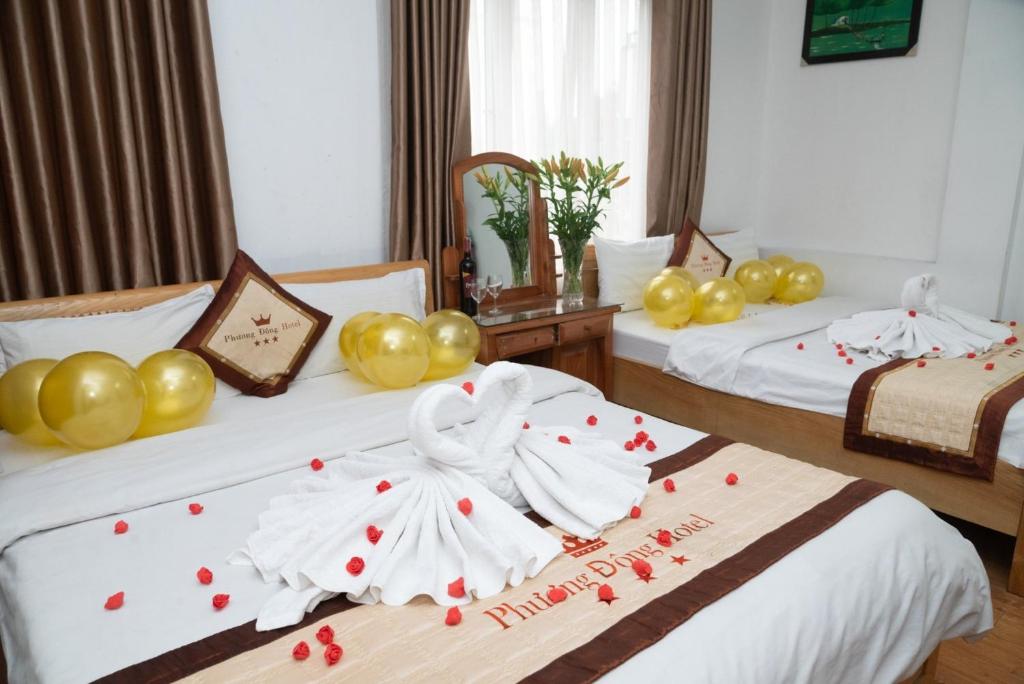 Postel nebo postele na pokoji v ubytování HOTTEL PHƯƠNG ĐÔNG