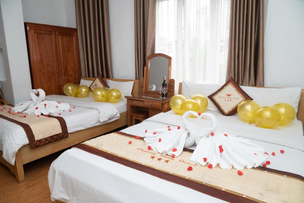 Postel nebo postele na pokoji v ubytování HOTTEL PHƯƠNG ĐÔNG