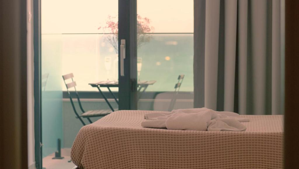 Postel nebo postele na pokoji v ubytování Poseidon Hotel