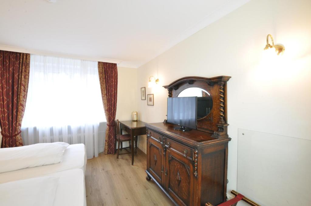Postel nebo postele na pokoji v ubytování Hotel Altmünchen by Blattl
