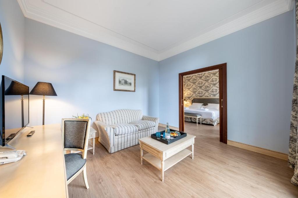 a living room with a couch and a table at Castilla Termal Solares in Solares