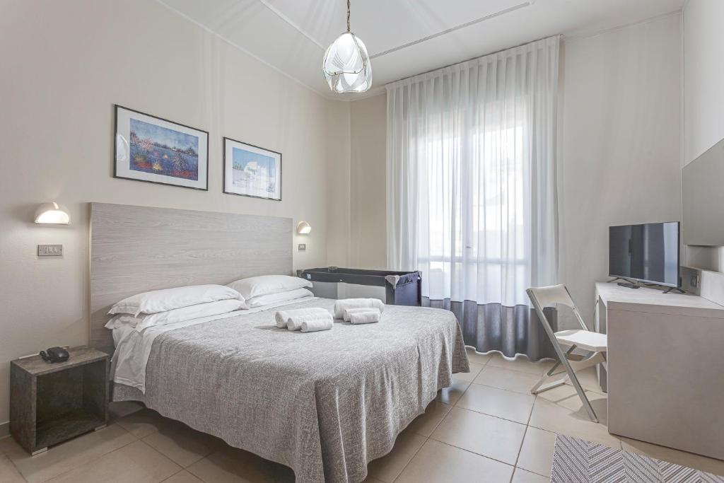 Postel nebo postele na pokoji v ubytování Hotel Caesar