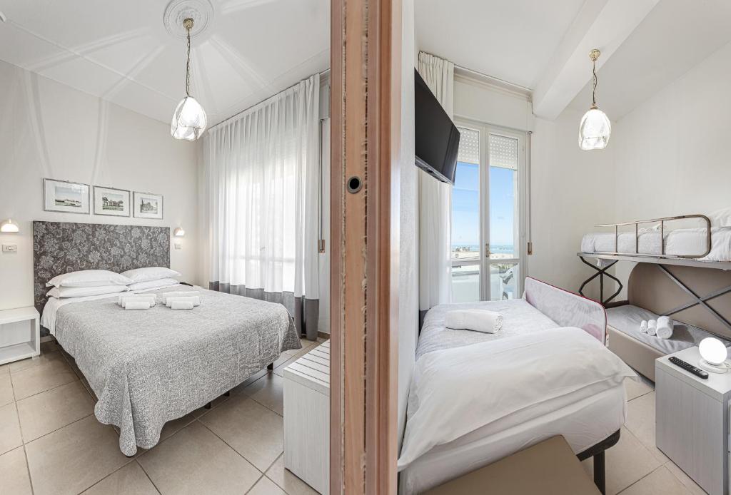 Postel nebo postele na pokoji v ubytování Hotel Caesar