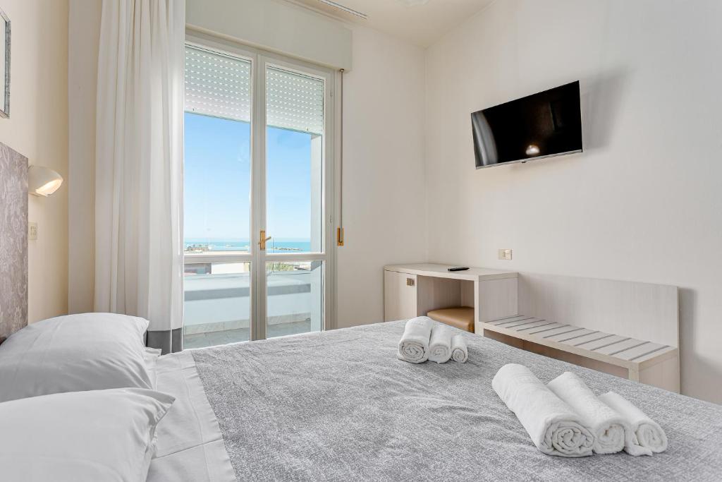 Postel nebo postele na pokoji v ubytování Hotel Caesar