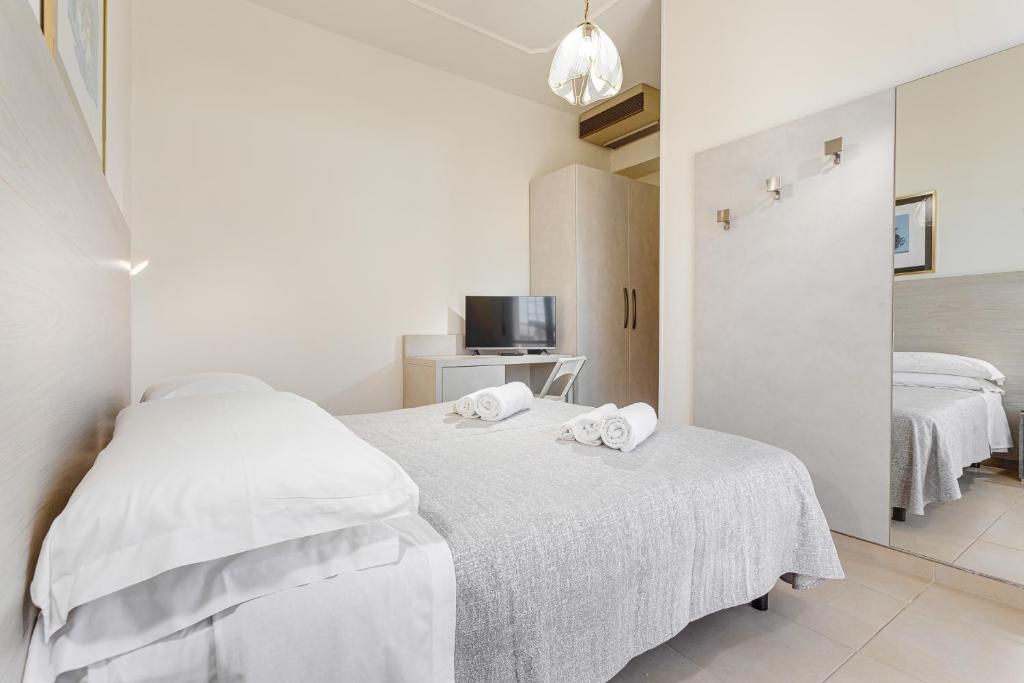 Postel nebo postele na pokoji v ubytování Hotel Caesar