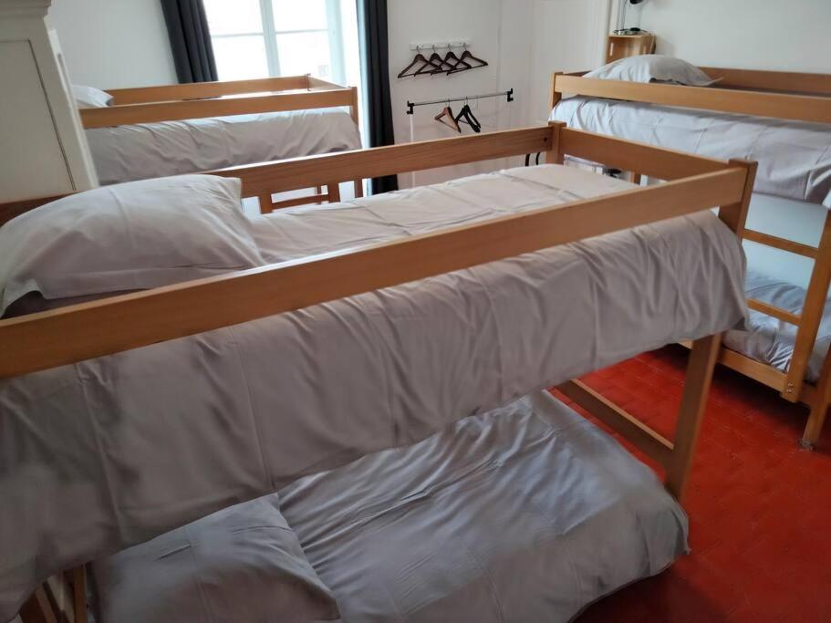 Letto o letti in una camera di Gîte de groupe 2 à 12 personnes