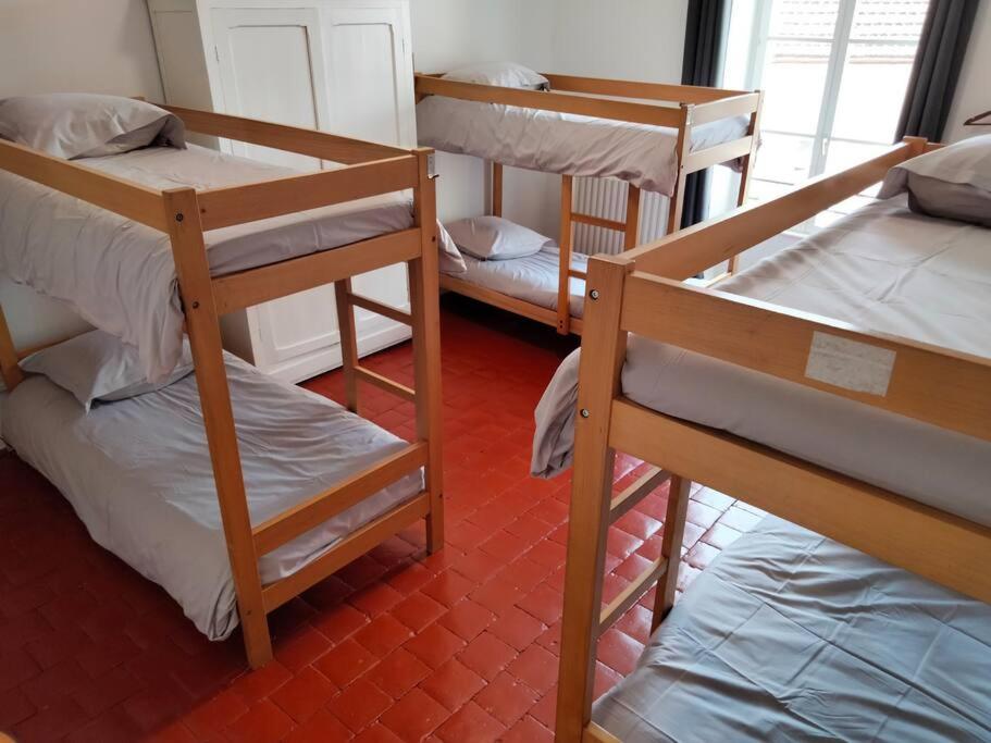 Letto o letti in una camera di Gîte de groupe 2 à 12 personnes