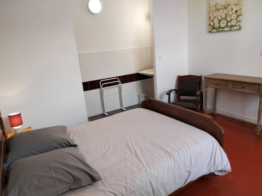 Letto o letti in una camera di Gîte de groupe 2 à 12 personnes