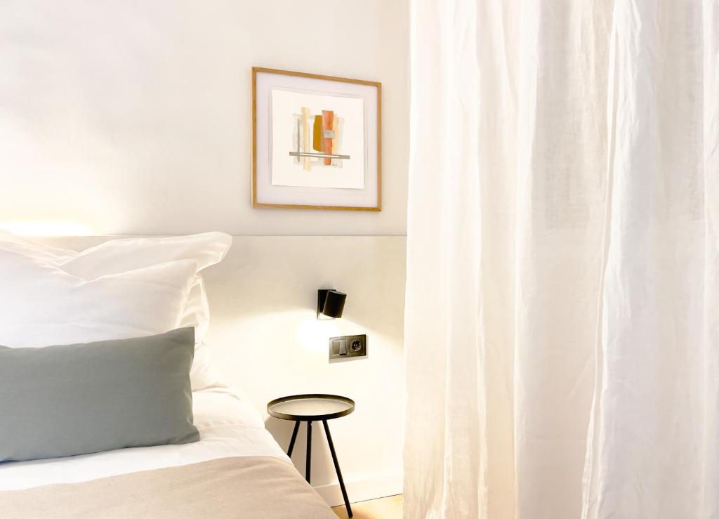 Postel nebo postele na pokoji v ubytování Calendula Hotel & Apartaments
