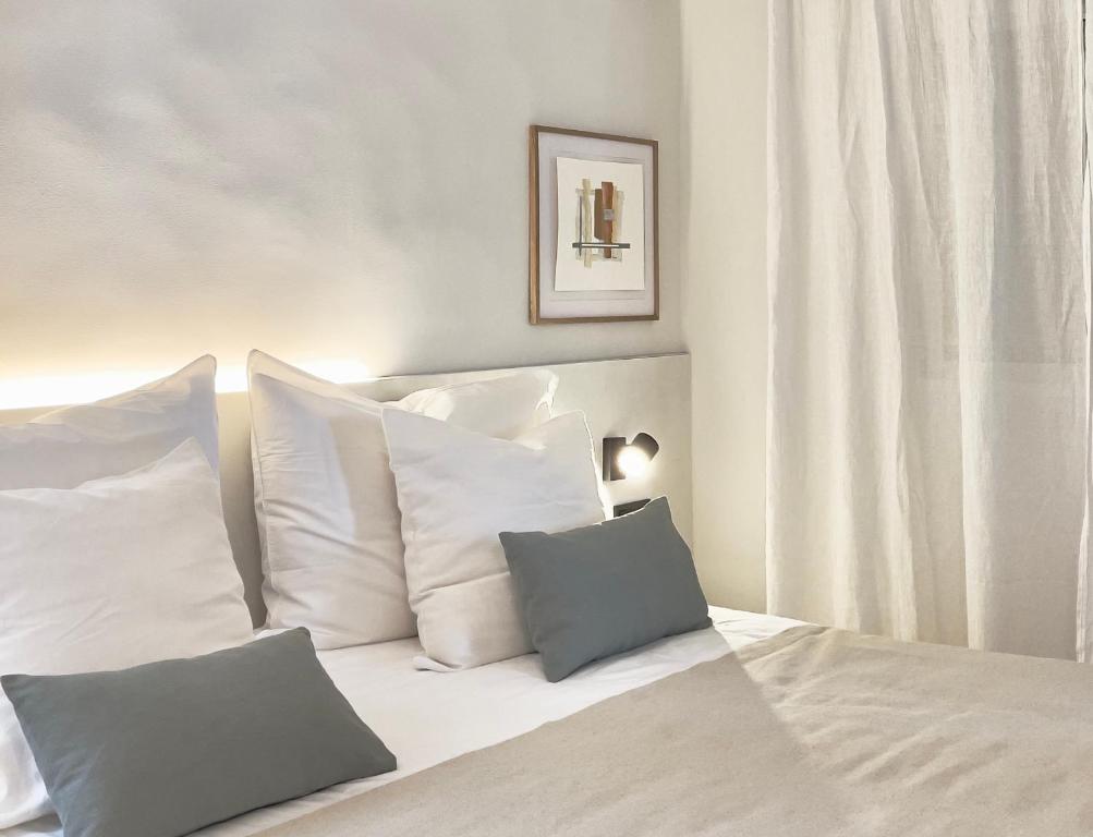 Postel nebo postele na pokoji v ubytování Calendula Hotel & Apartaments