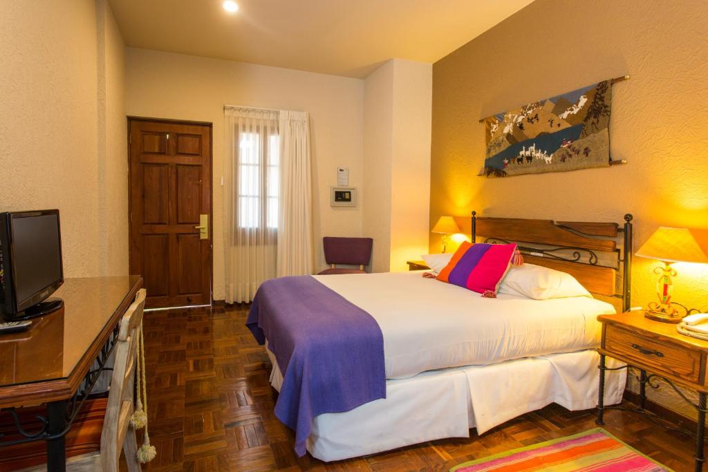 Ein Bett oder Betten in einem Zimmer der Unterkunft Hotel Rosario La Paz