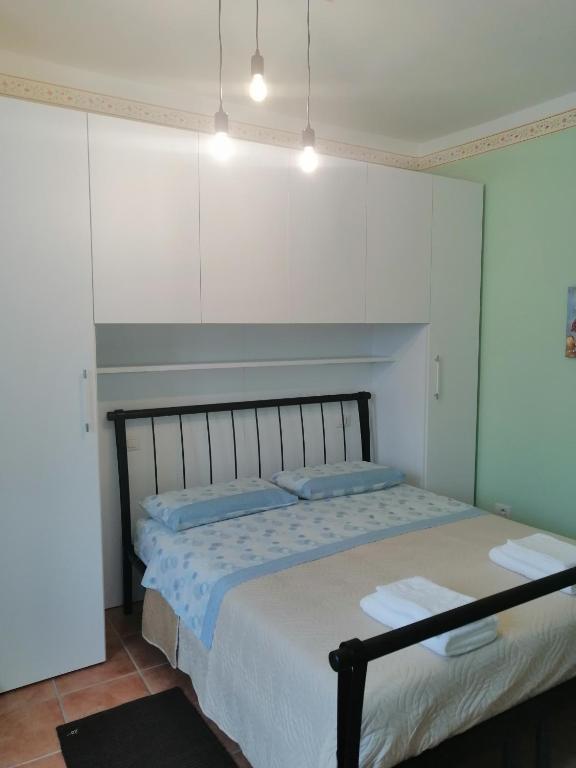 Postel nebo postele na pokoji v ubytování SPELLO ROMANTICA