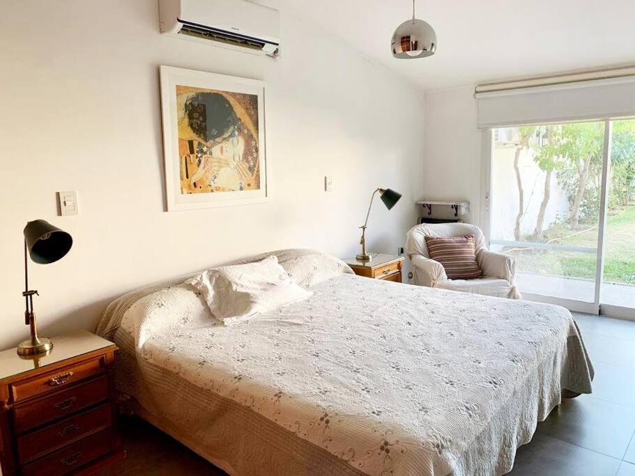 Posteľ alebo postele v izbe v ubytovaní Casa con Jardín y Parrilla