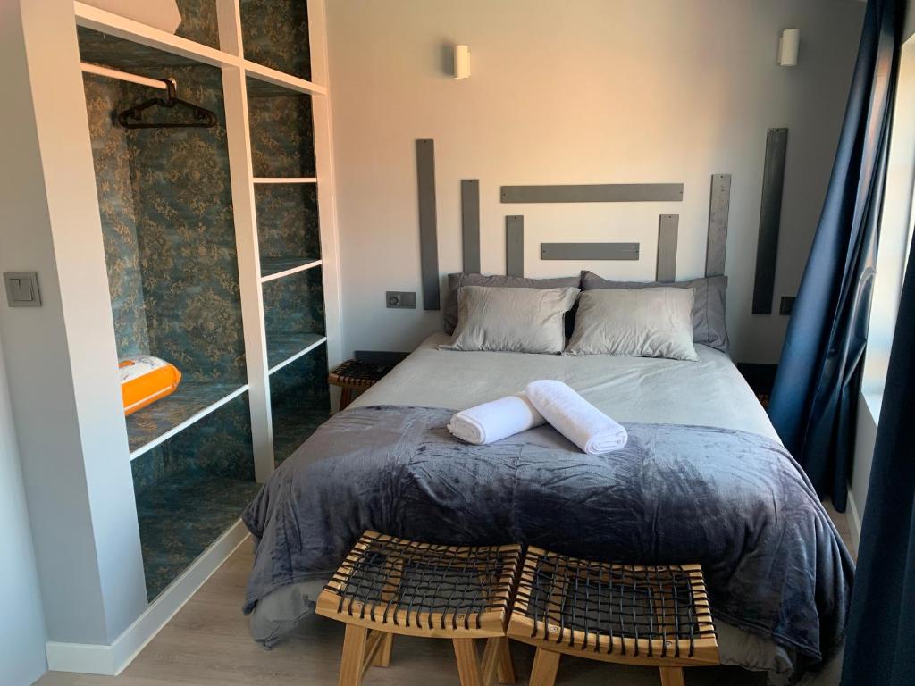Postel nebo postele na pokoji v ubytování NOARU Apartamentos