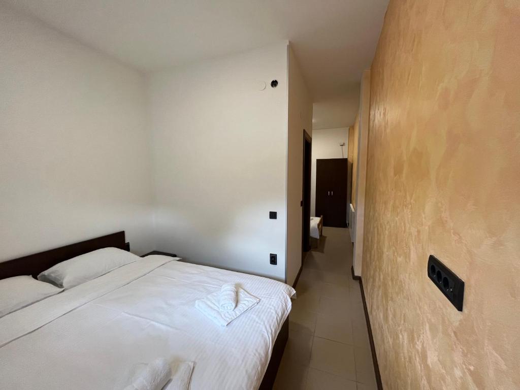 Postel nebo postele na pokoji v ubytování Apartmani Bosfor