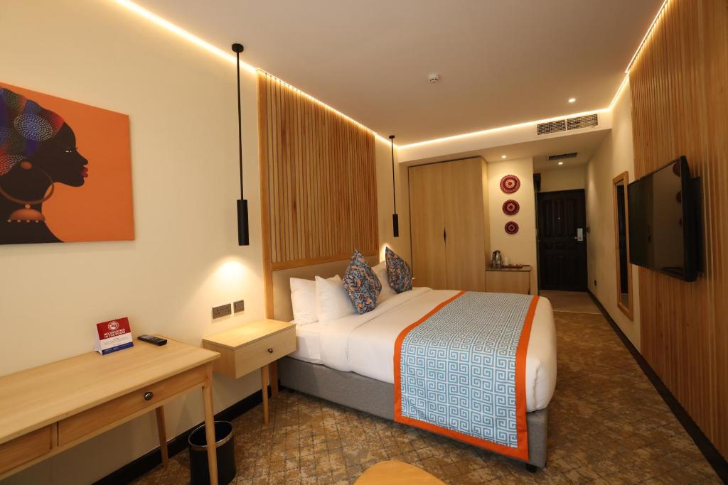 TV a/nebo společenská místnost v ubytování PrideInn Westlands Luxury Boutique Hotel