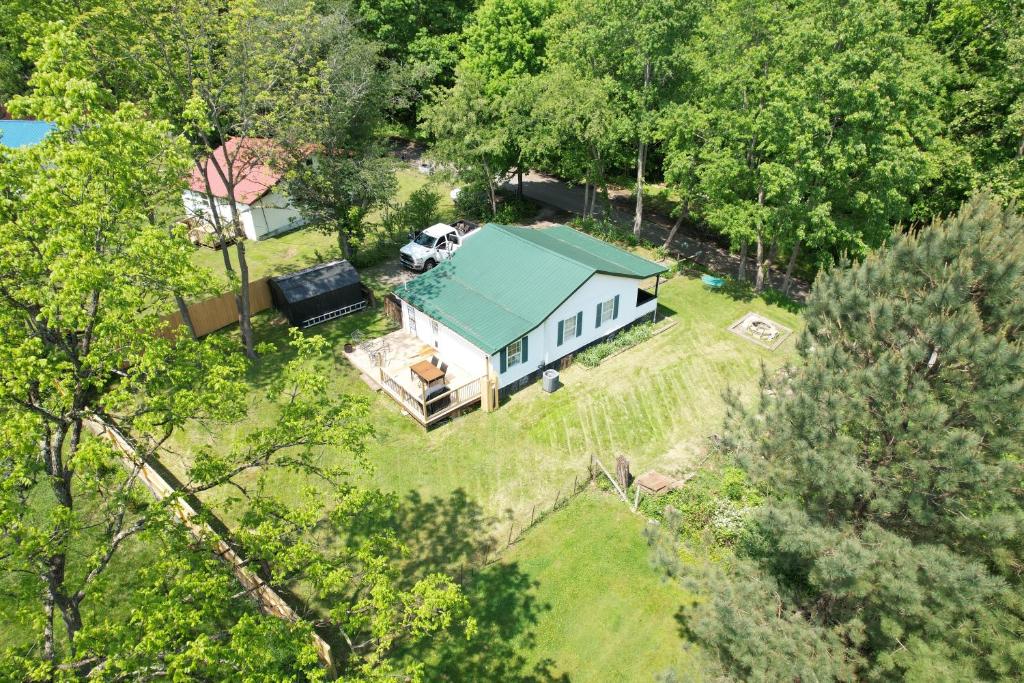 an aerial view of a white house with a green roof at Black Ridgetop at NRG National Park in Lansing